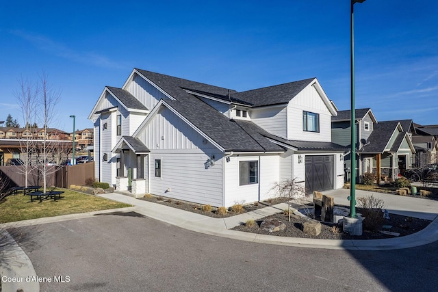1853 W Felton Dr, Coeur Dalene, ID 83814 - modern farmhouse style home with driveway, a shingled roof, board and batten siding, and a residential view