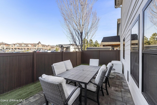 1853 W Felton Dr, Coeur Dalene, ID 83814 - view of patio / terrace featuring outdoor dining area, a fenced backyard, and a residential view