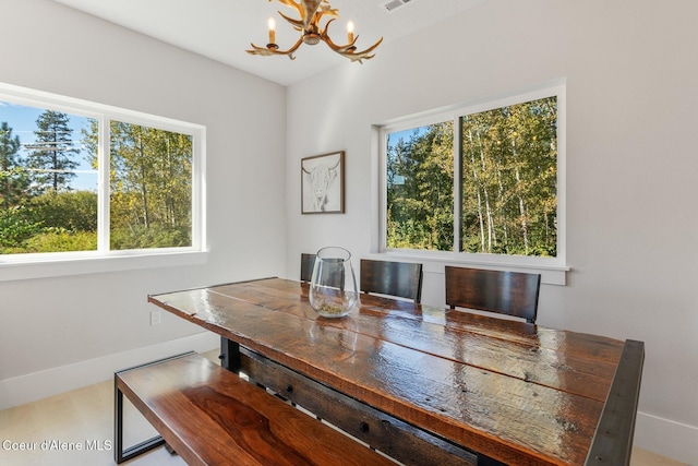 dining space featuring an inviting chandelier