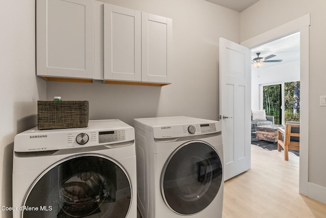 laundry room with separate washer and dryer, light wood-type flooring, a ceiling fan, and cabinet space