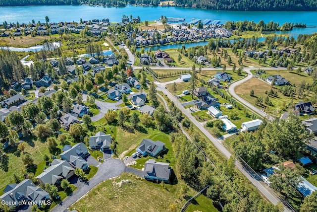 aerial view with a water view and a residential view