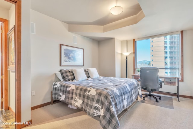 bedroom with carpet flooring, visible vents, and baseboards