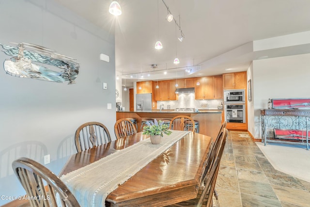 dining room featuring stone finish floor