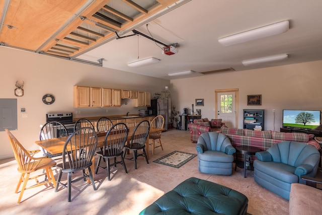 dining space featuring concrete flooring and electric panel