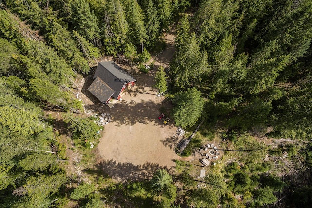 drone / aerial view featuring a view of trees