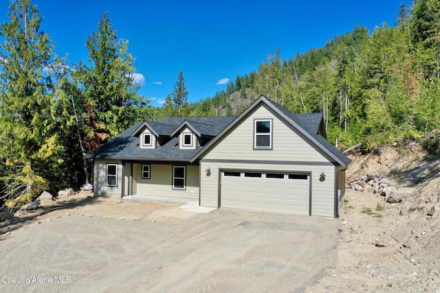 view of front of home featuring driveway and a garage