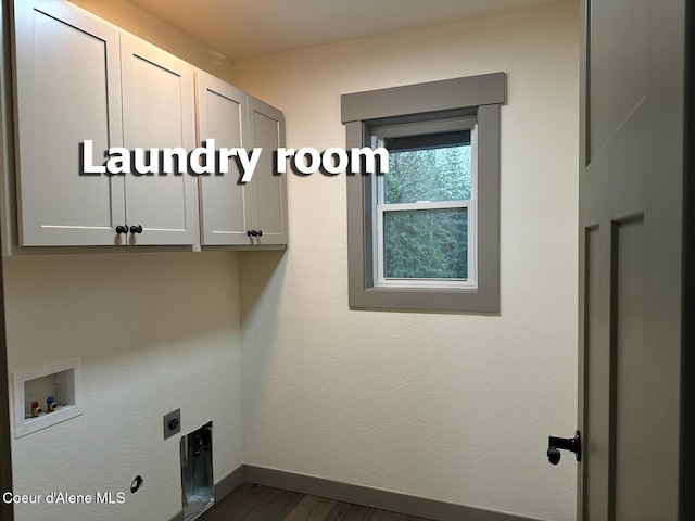 laundry area featuring hookup for a washing machine, dark wood-type flooring, baseboards, cabinet space, and electric dryer hookup