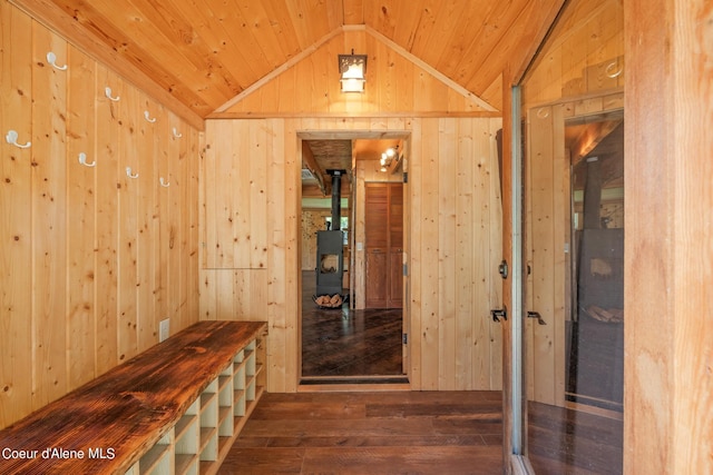 interior space with wood ceiling, vaulted ceiling, wooden walls, and wood finished floors