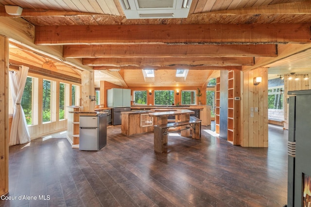 recreation room featuring wood walls, wood ceiling, dark wood-style flooring, and beamed ceiling