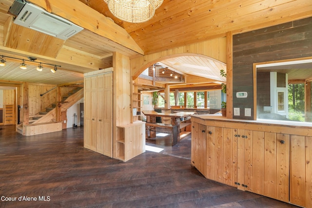 kitchen featuring dark wood-style floors, lofted ceiling, wood ceiling, and wood walls