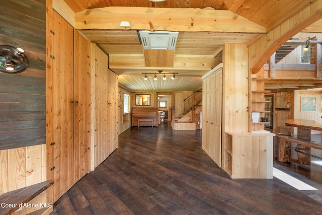 corridor featuring wooden ceiling, stairs, and wood walls