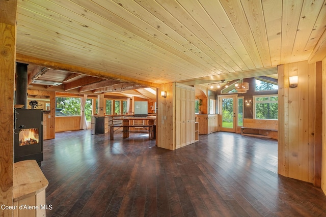 unfurnished living room featuring dark wood-type flooring, wood ceiling, and wood walls