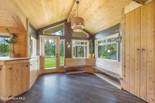 unfurnished sunroom featuring vaulted ceiling with beams and wooden ceiling