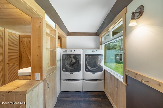 laundry area featuring laundry area, dark wood finished floors, and washing machine and clothes dryer