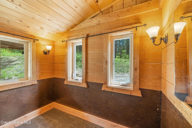 unfurnished room with lofted ceiling and wooden ceiling