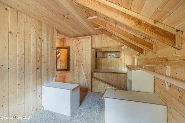 interior space with carpet, wooden ceiling, vaulted ceiling, and wooden walls