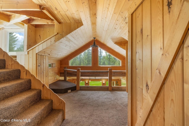 additional living space featuring carpet floors, wood ceiling, wooden walls, and vaulted ceiling