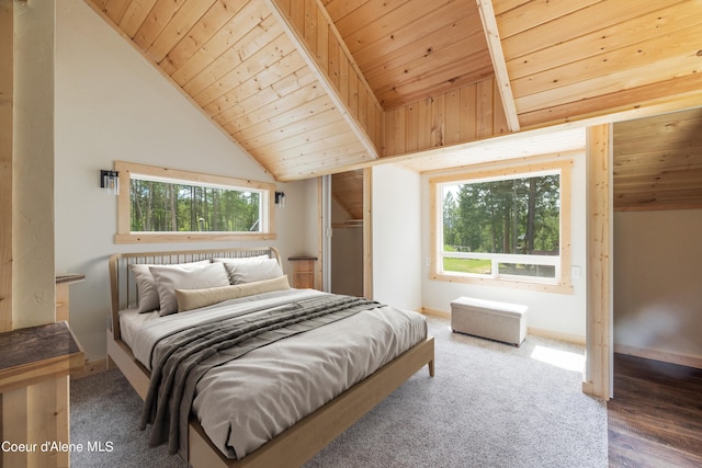 carpeted bedroom featuring lofted ceiling, wood ceiling, and baseboards