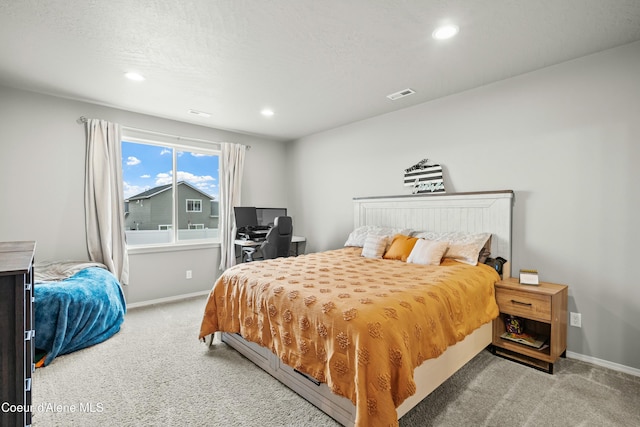 bedroom featuring recessed lighting, visible vents, light carpet, a textured ceiling, and baseboards