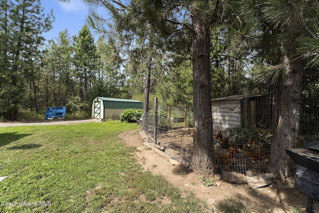11248 N Bruss Rd, Rathdrum, ID 83858 - view of yard featuring an outbuilding and a shed