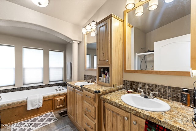 11248 N Bruss Rd, Rathdrum, ID 83858 - bathroom featuring a bath, a stall shower, vaulted ceiling, and a sink