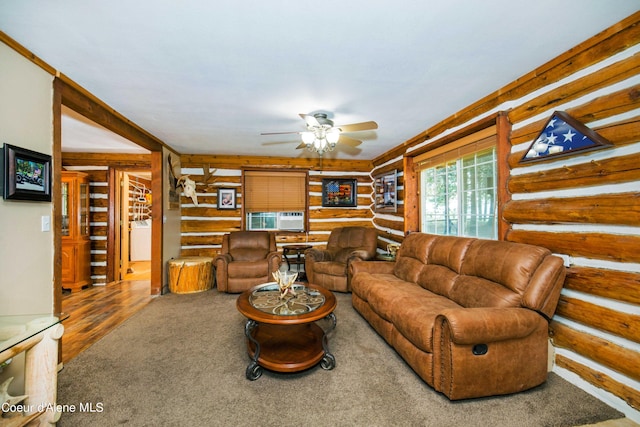 living room with carpet, rustic walls, cooling unit, and a ceiling fan