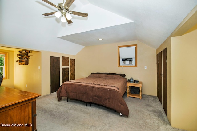 bedroom featuring lofted ceiling, ceiling fan, light carpet, and cooling unit