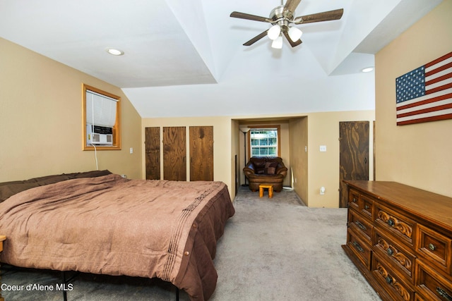 bedroom featuring lofted ceiling, ceiling fan, light carpet, and cooling unit