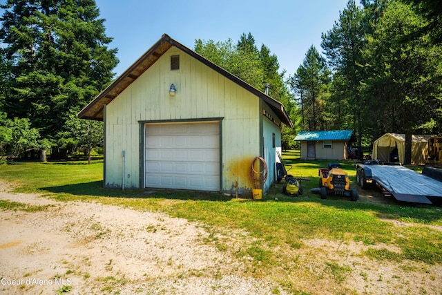 detached garage featuring driveway