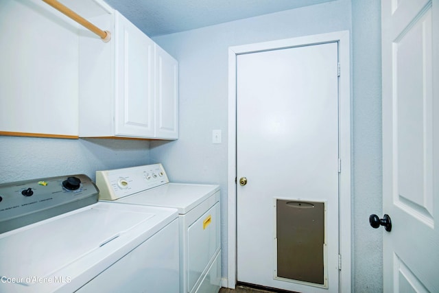 laundry area with washing machine and dryer and cabinet space