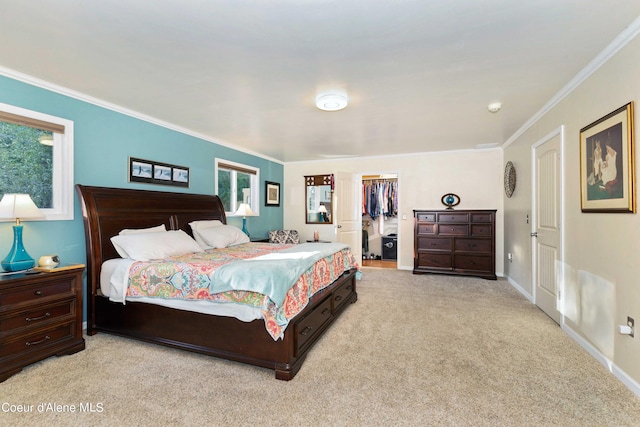 bedroom with baseboards, ornamental molding, a walk in closet, carpet floors, and a closet