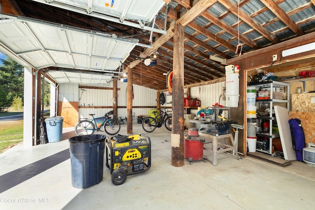 garage featuring metal wall and a garage door opener