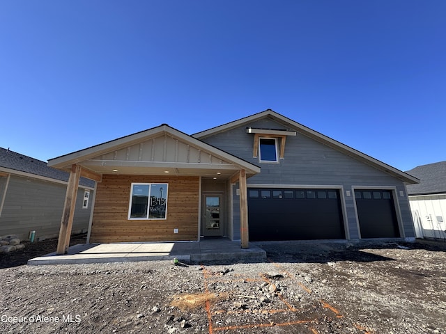 view of front facade featuring an attached garage and board and batten siding