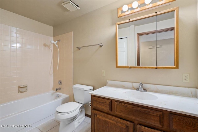 full bathroom featuring toilet, vanity, visible vents, tile patterned floors, and washtub / shower combination