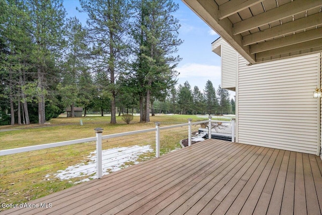 wooden deck with a yard