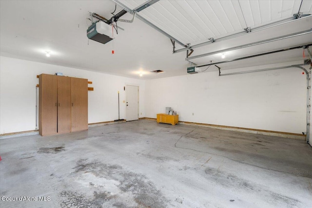 garage featuring a garage door opener