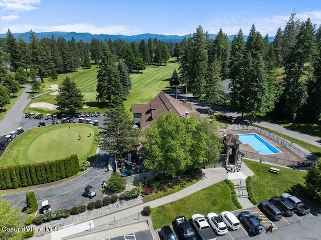 bird's eye view featuring a mountain view and golf course view