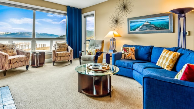 carpeted living room with a mountain view