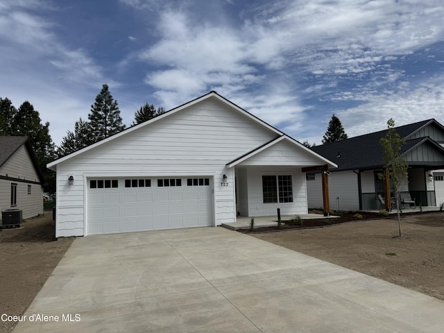 722 E Valley St S, Oldtown, ID 83822 - view of front of property featuring cooling unit, driveway, and an attached garage