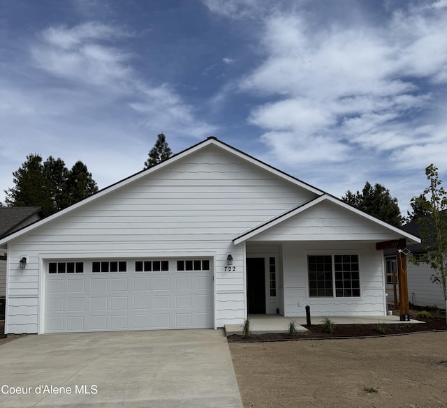722 E Valley St S, Oldtown, ID 83822 - view of front of house featuring driveway, a garage, and a porch