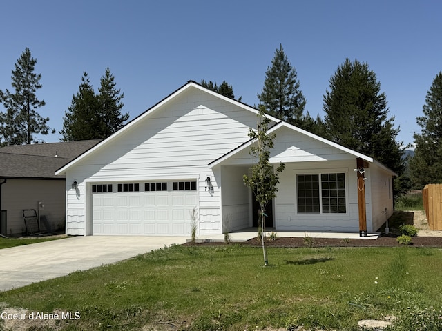 722 E Valley St S, Oldtown, ID 83822 - single story home featuring concrete driveway, a garage, and a front lawn