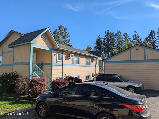 1810 Spokane St 1800, 1802, 1804, 1806, 1808, Post Falls, ID 83854 - view of side of home featuring a shingled roof