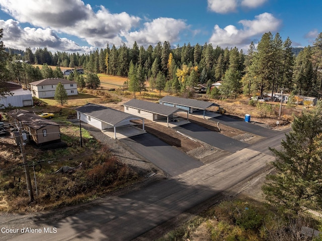 drone / aerial view featuring a view of trees