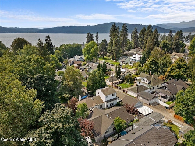 birds eye view of property featuring a water view and a residential view