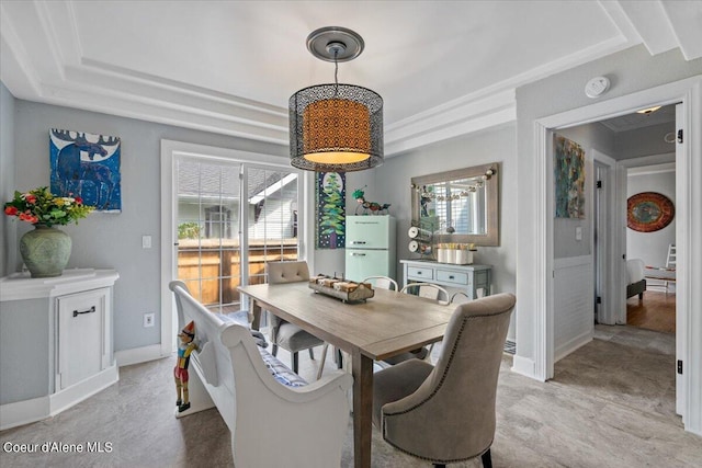 dining space featuring baseboards