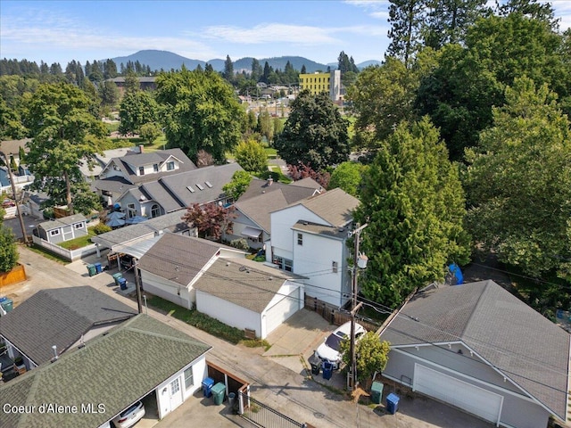 drone / aerial view featuring a residential view and a mountain view