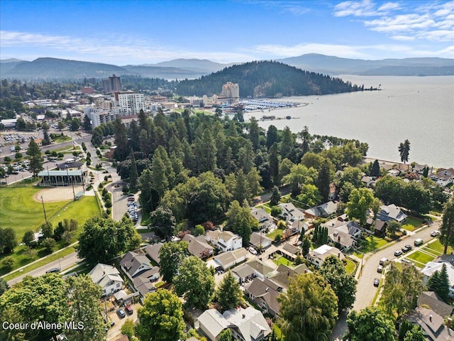 aerial view featuring a water and mountain view