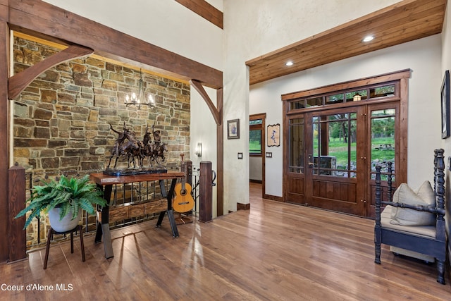 entryway featuring recessed lighting, a notable chandelier, and wood finished floors