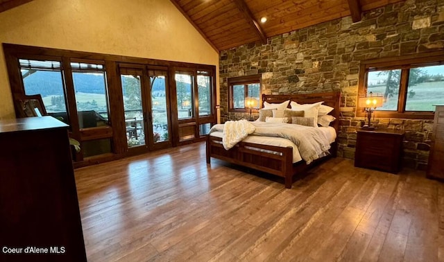 bedroom featuring beam ceiling, wood ceiling, high vaulted ceiling, multiple windows, and hardwood / wood-style floors