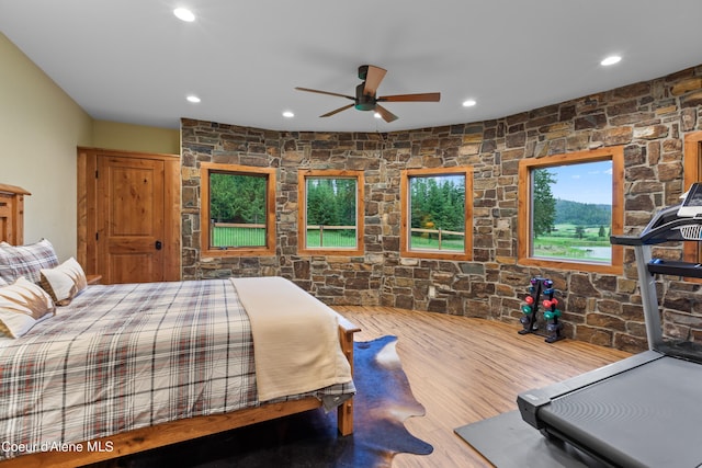 bedroom featuring wood finished floors and recessed lighting